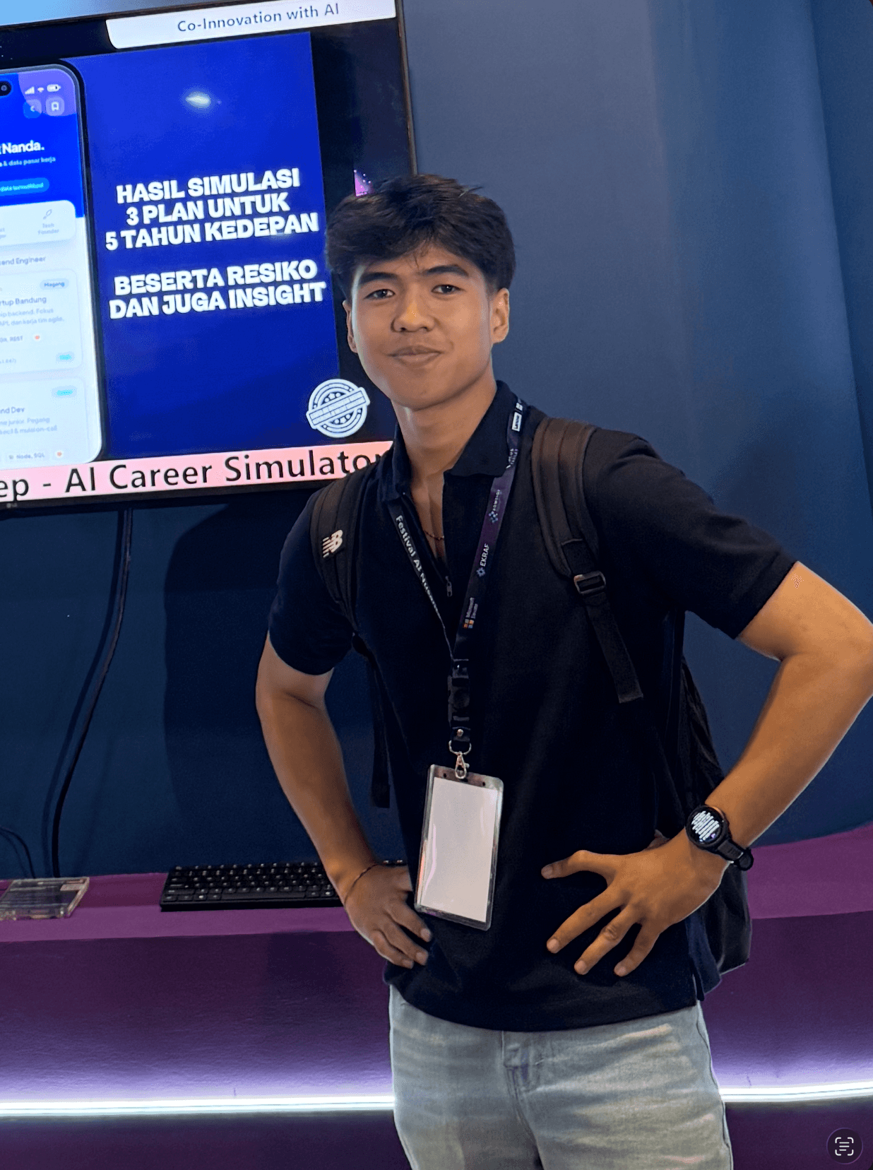 Nanda in front of the FirStep screen at the Festival AI Nusantara booth